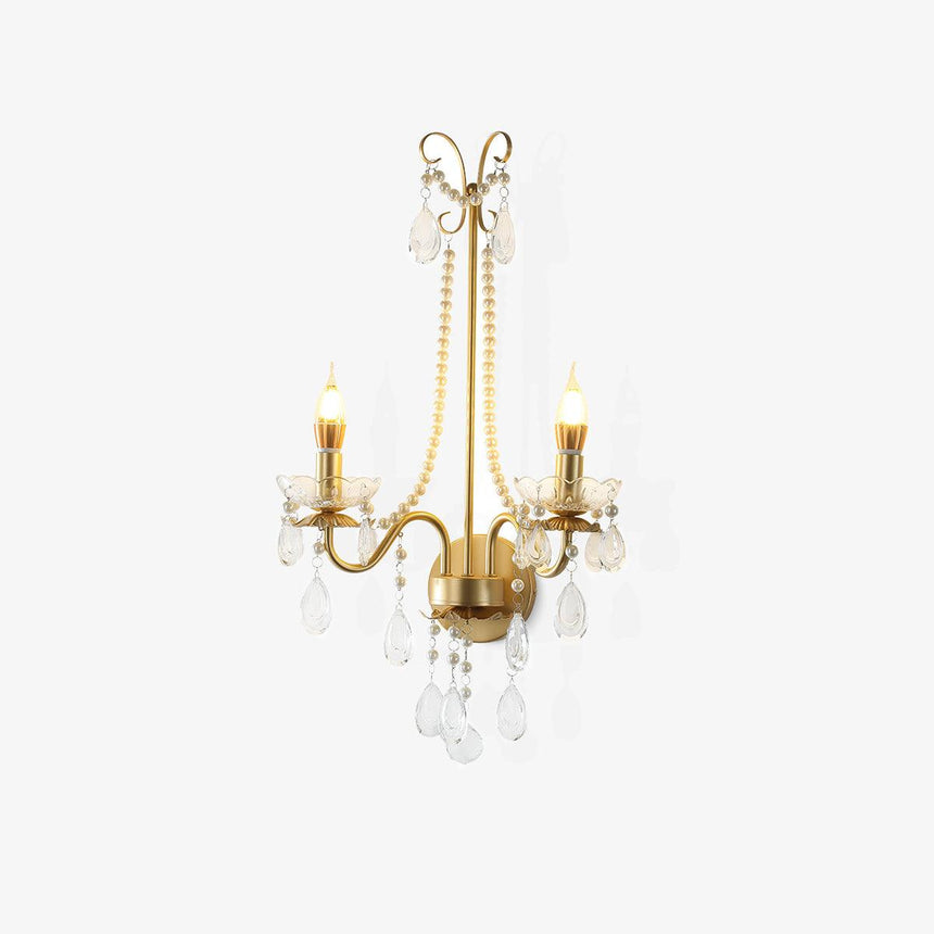 Gold wall sconce with two candle arms, scrolled top, pearl chains and crystal drops