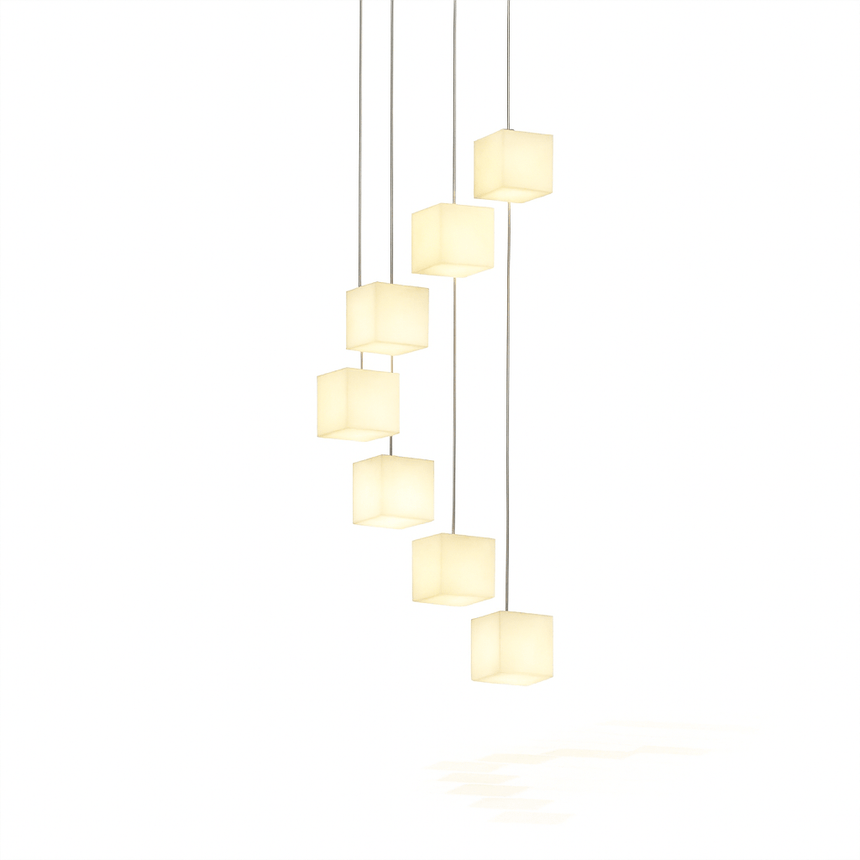 The same cascade of alabaster cubes lit, warm light through the stone