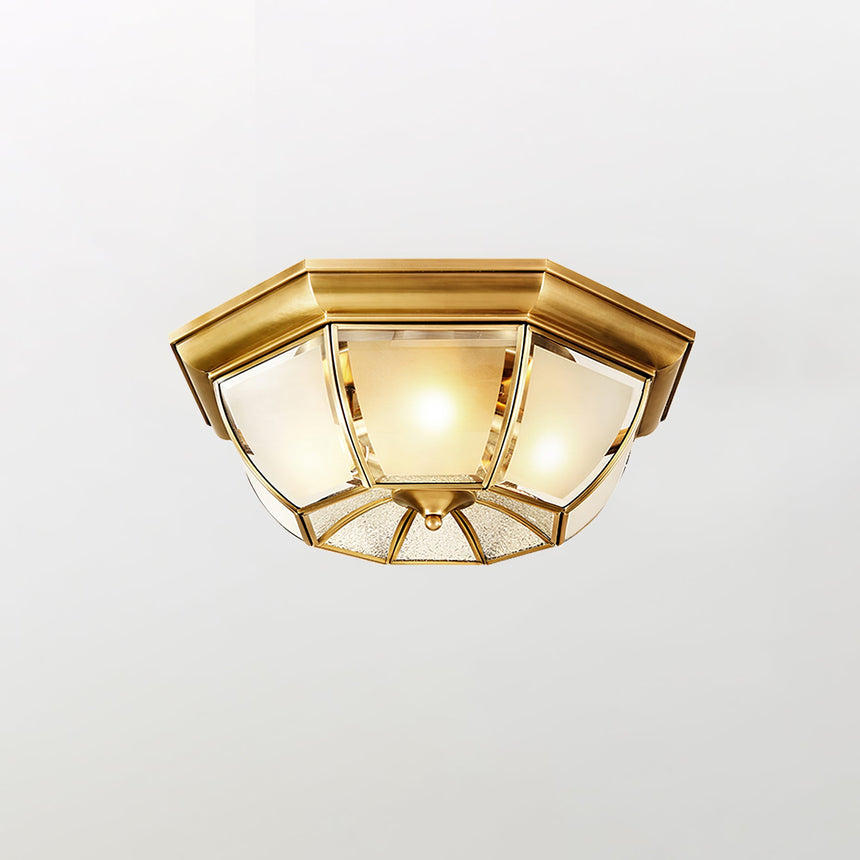 Smaller octagonal brass ceiling light on a pale backdrop