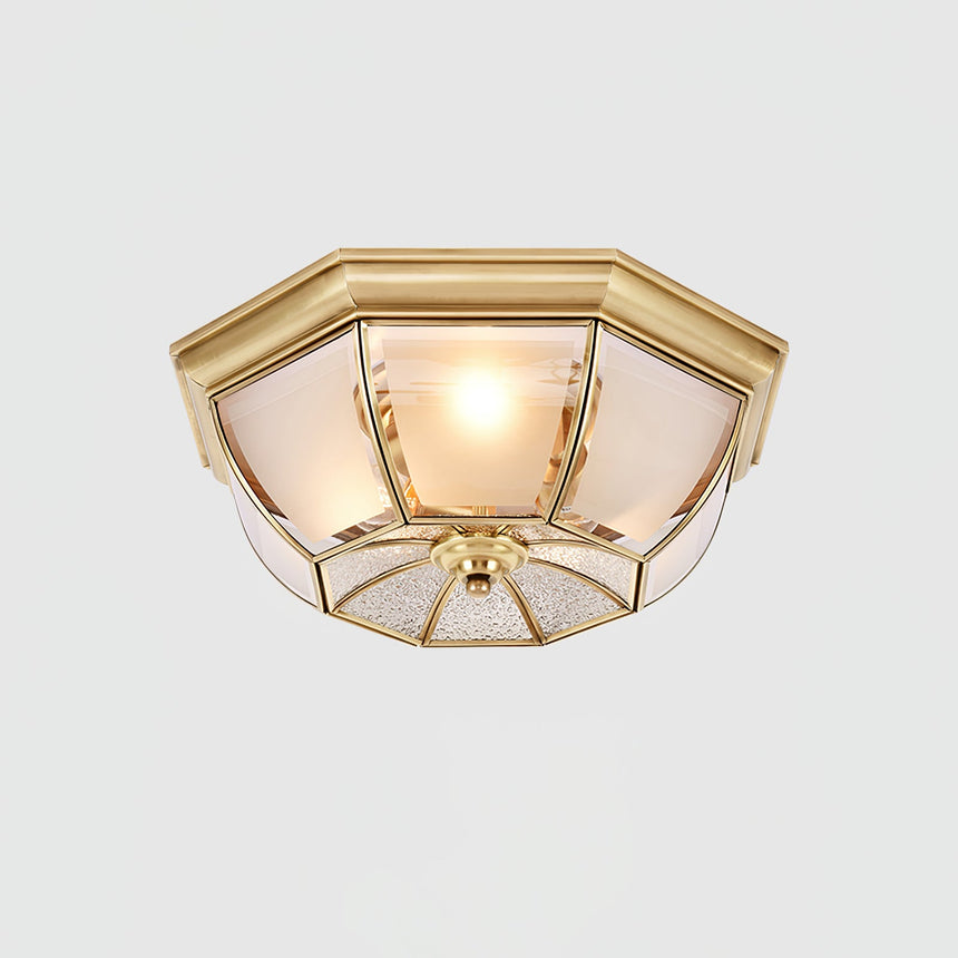 Octagonal brass ceiling light seen from the side, unlit