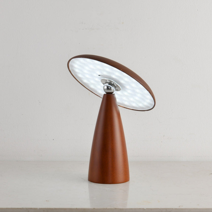 Close view of the lit disc face and the metal tilting joint