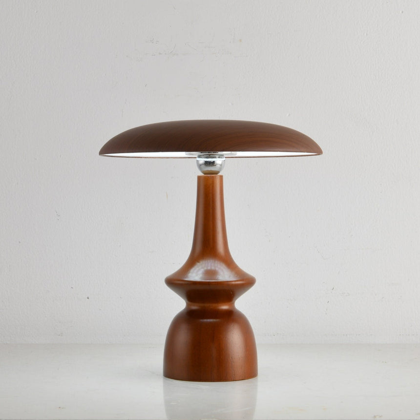 Portable table lamp on a spindle base seen from the front