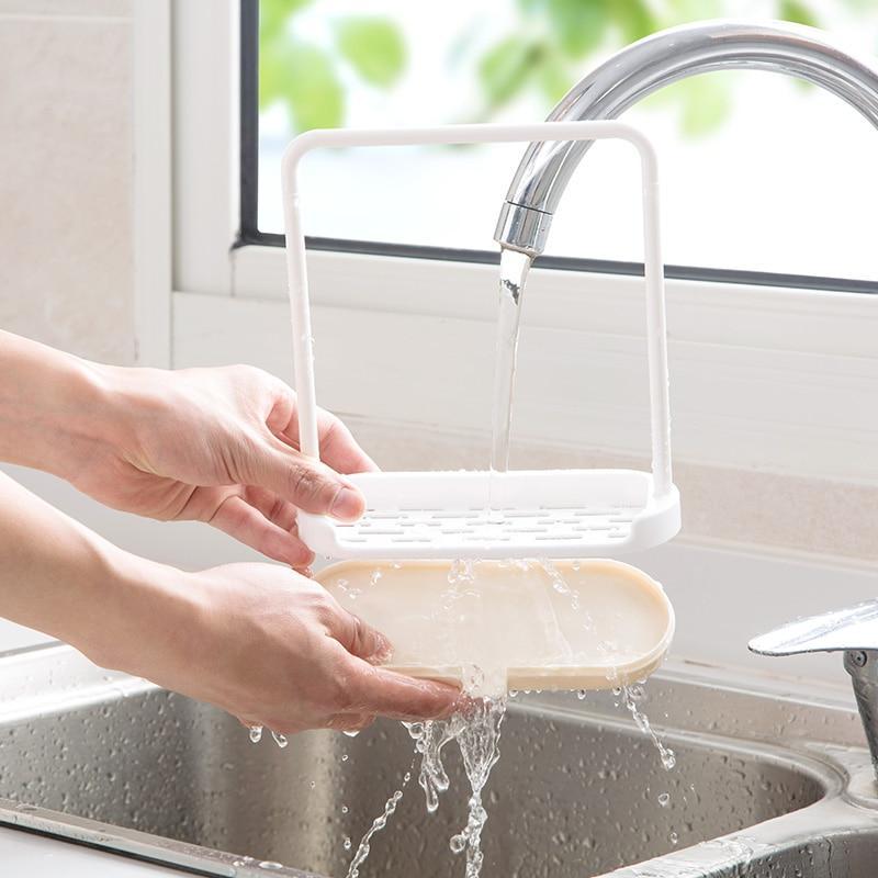 Dishcloth holder mounted near kitchen sink