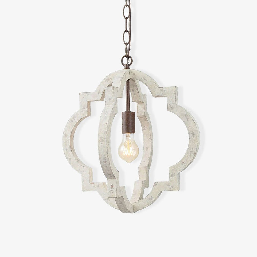 A quatrefoil frame of aged white wood around a single filament lamp on a chain
