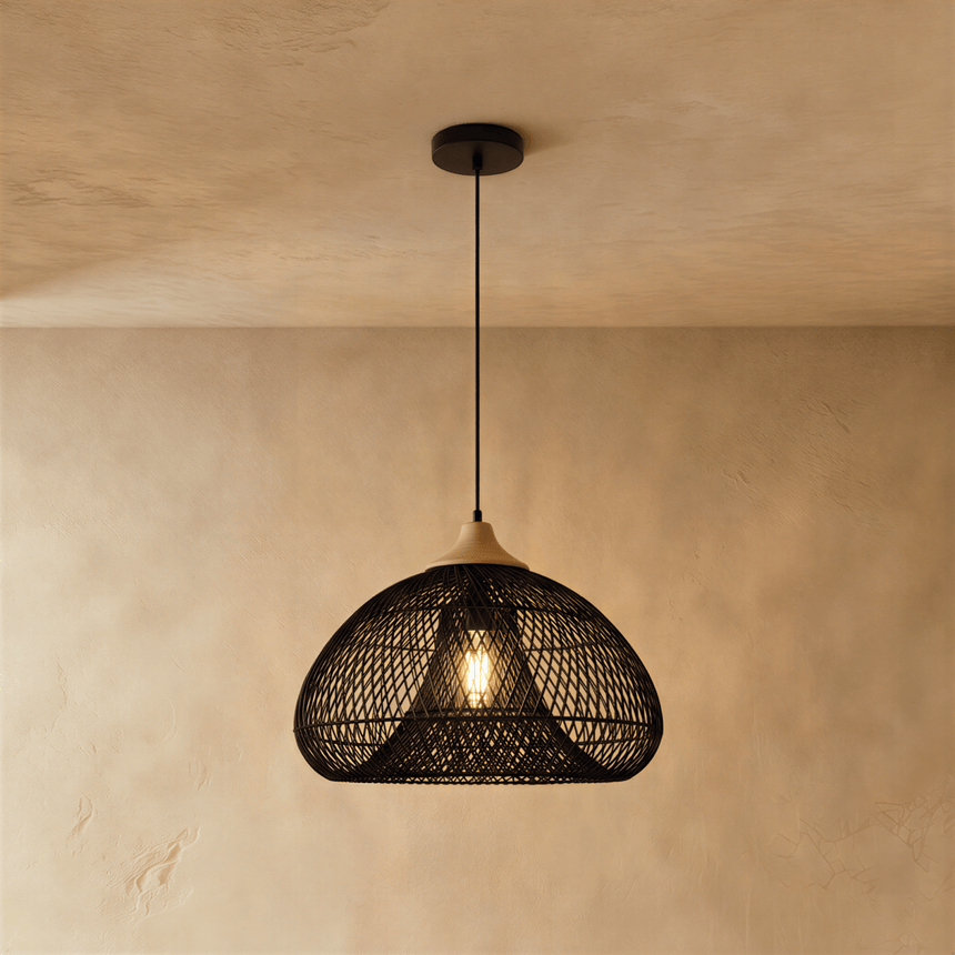 The same wide dome in black, the weave throwing a pattern on the plaster