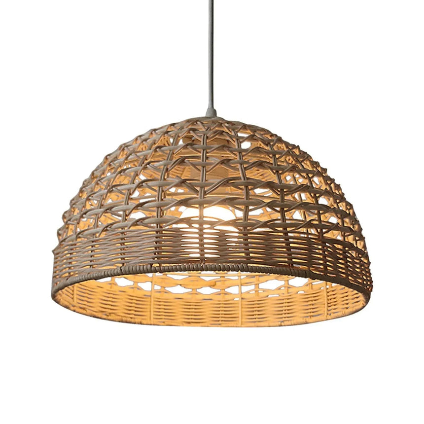 Rattan dome switched on, the weave glowing from within