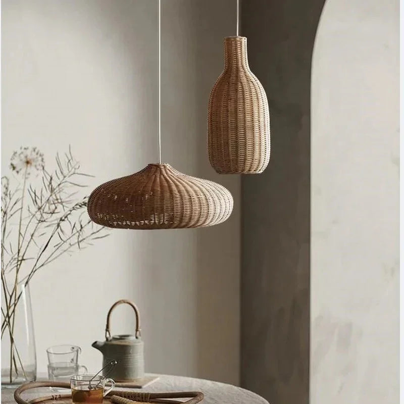 Low woven dome beside a tall teardrop shade in a gray room