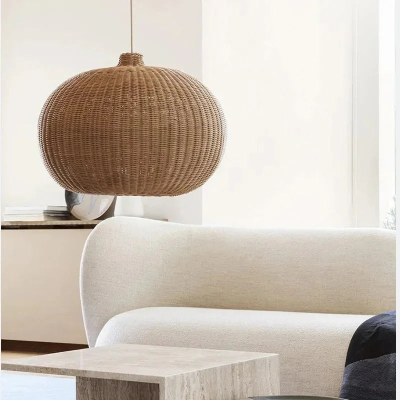 Large round woven shade above a curved sofa
