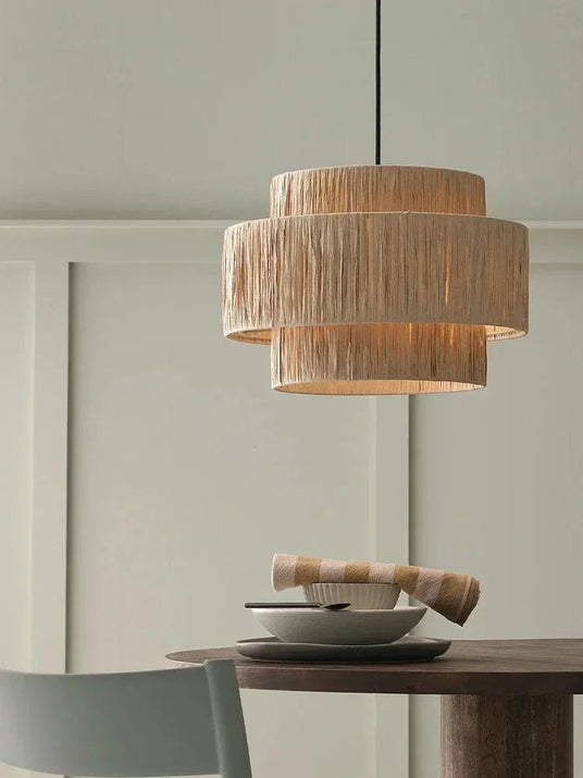 Rattan drum pendant light above a console table