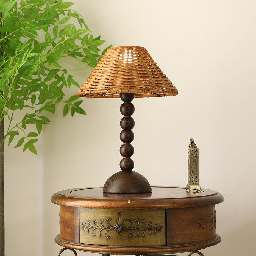 Close view of the stacked bead turnings and the domed walnut foot