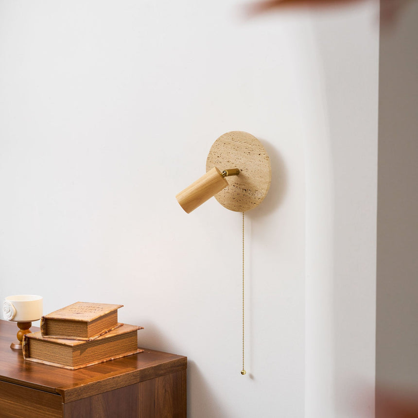 Oak head lit close above a nightstand with books and a small wood box