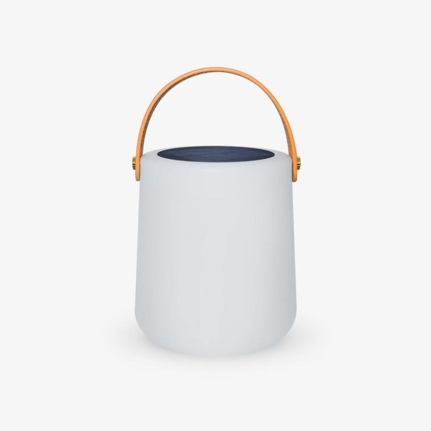 Small white cylinder lamp with a leather carry strap and a solar top