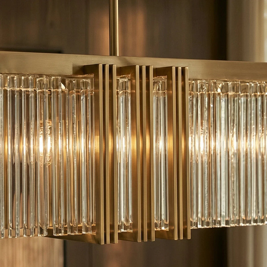 The ribbed clear shades side by side in their gold frame, each lit from inside
