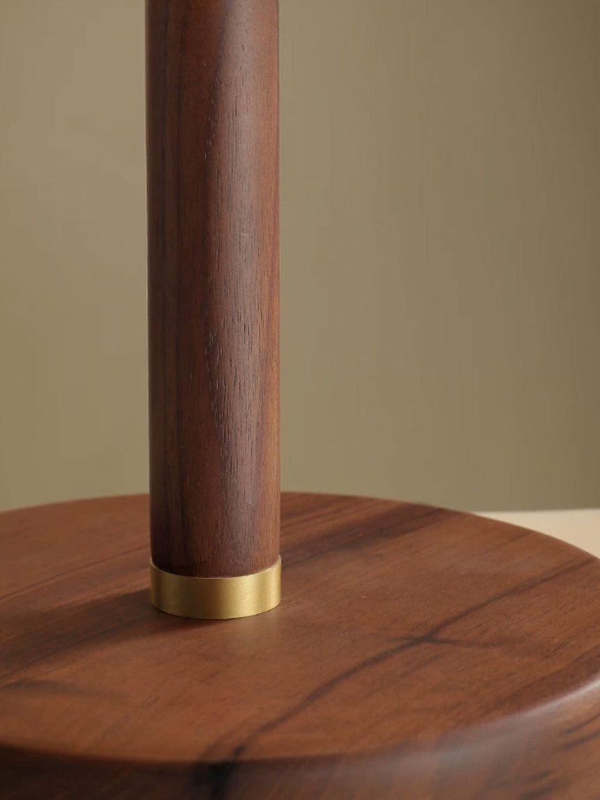 Close view of the walnut neck and the brass collar at the foot