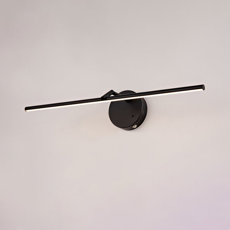The matte black version seen at an angle, a dark arm crossing a round plate