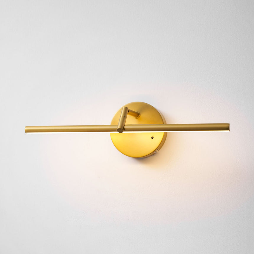 The gold version lit, the tube bright and the disc plate catching the glow