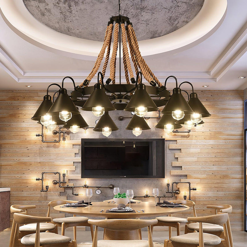 Chandelier lit above a pale dining table with a screen behind it