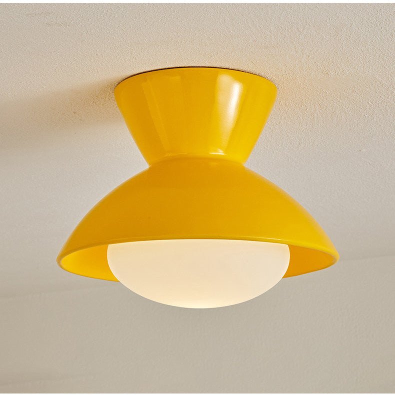 Close view of the yellow gourd ceiling light and its opal glass dome