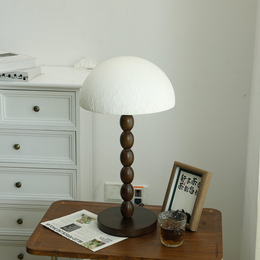 Rice paper table lamp unlit, the creases of the paper dome visible