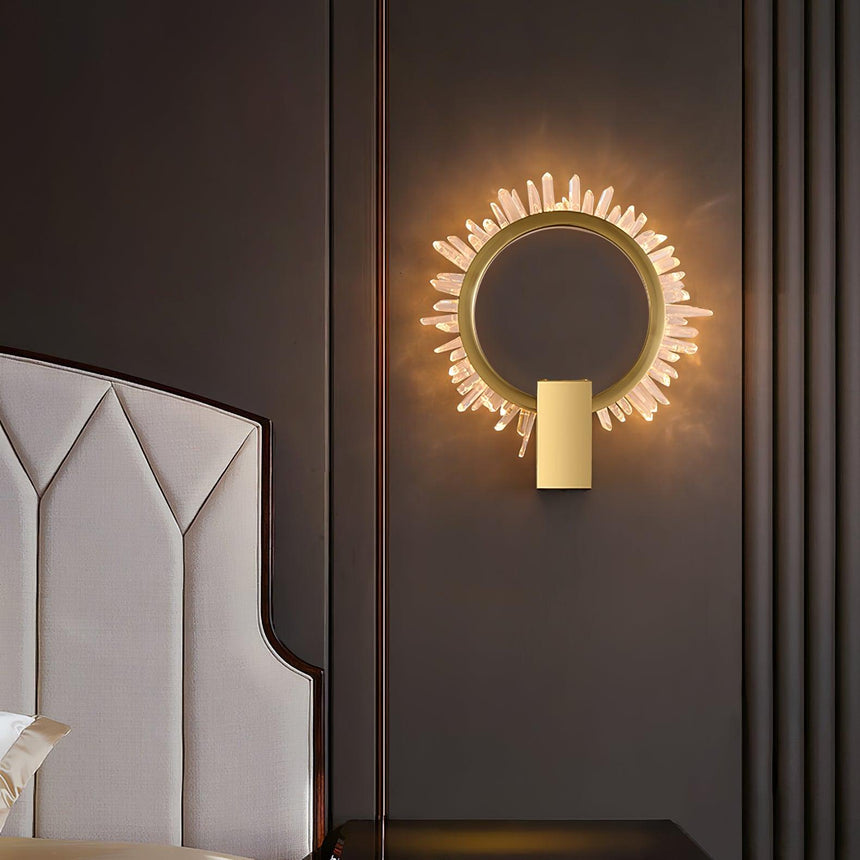 The ring lit beside a white upholstered headboard
