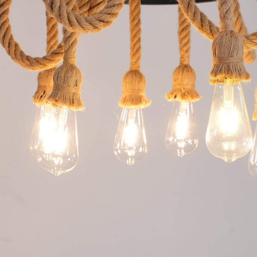 Four filament lamps burning at the foot of their rope swags