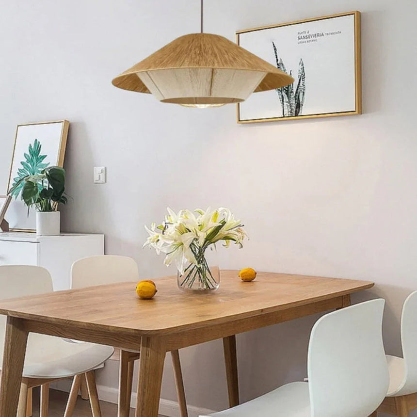 Hemp rope shade above a wooden table with a vase