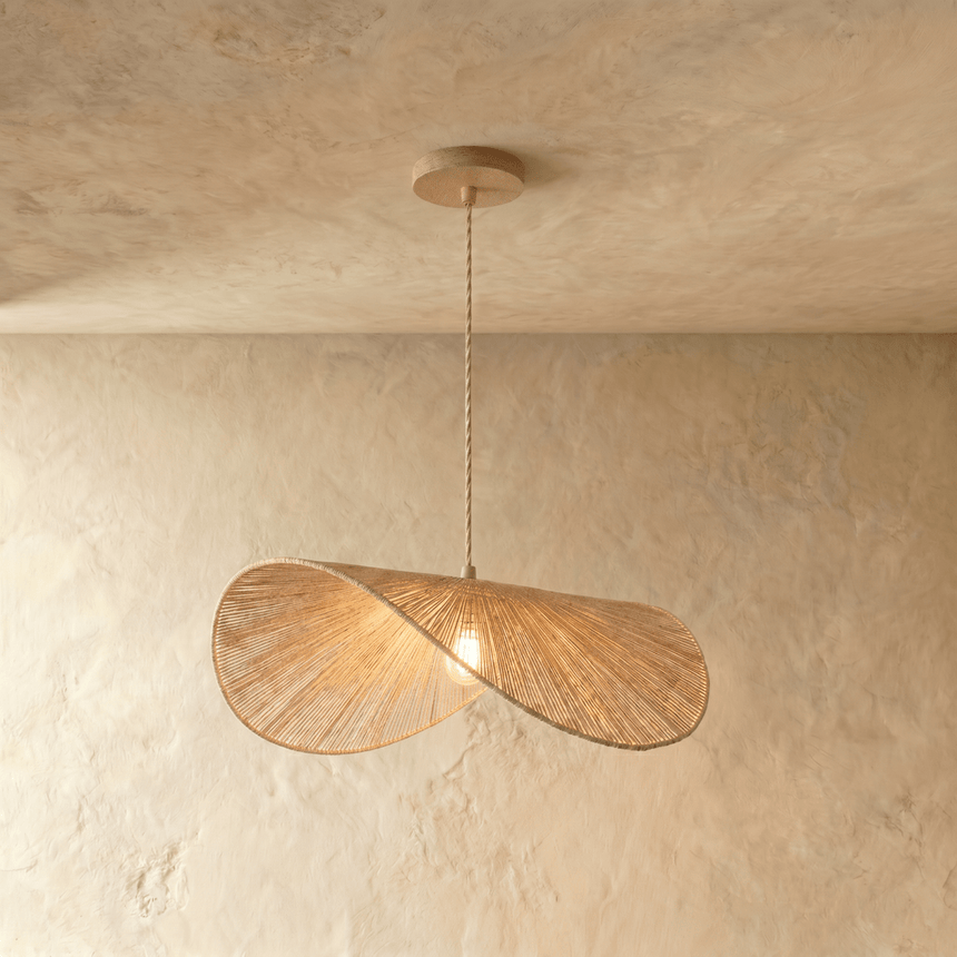 Two overlapping discs of woven pale hemp rope hung from a fine braided cord