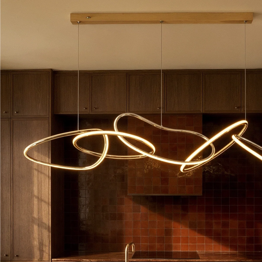 The loops lit in a dark wood kitchen with tiled walls and warm afternoon light