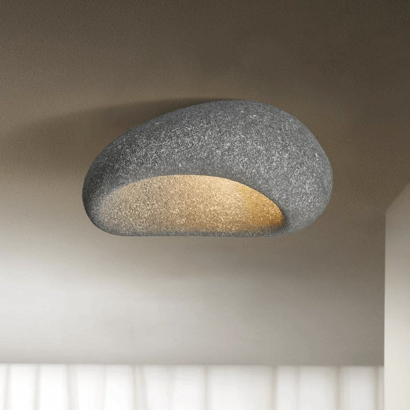 Dark gray stone spot dome ceiling light against a plain background