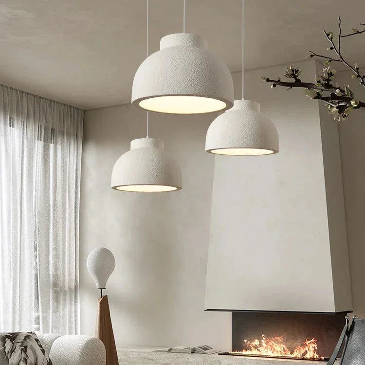 Textured white dome hung in a corner of a bright room