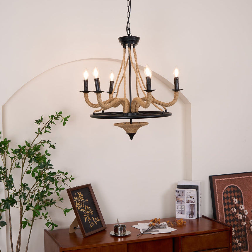 The fitting lit in a room corner beside a plant and a low cabinet