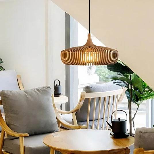 Natural wood shade lit in a living room with a sofa and plants