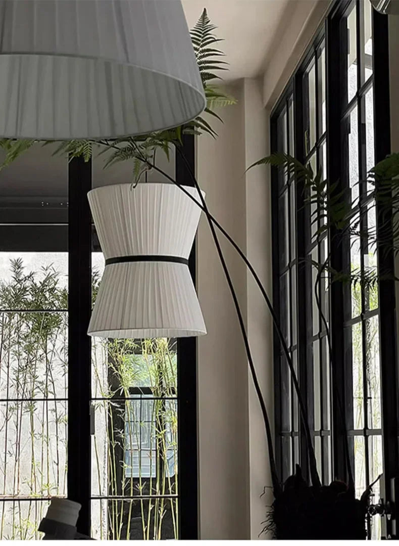 Knitted hourglass shade lit from inside in a dark room