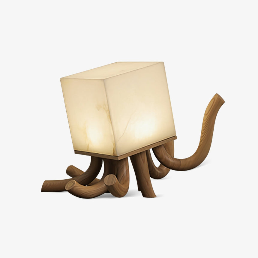 Sculptural table lamp with carved wood roots under an alabaster cube