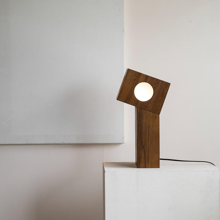 Side view of the teak lamp showing one round diffuser lit