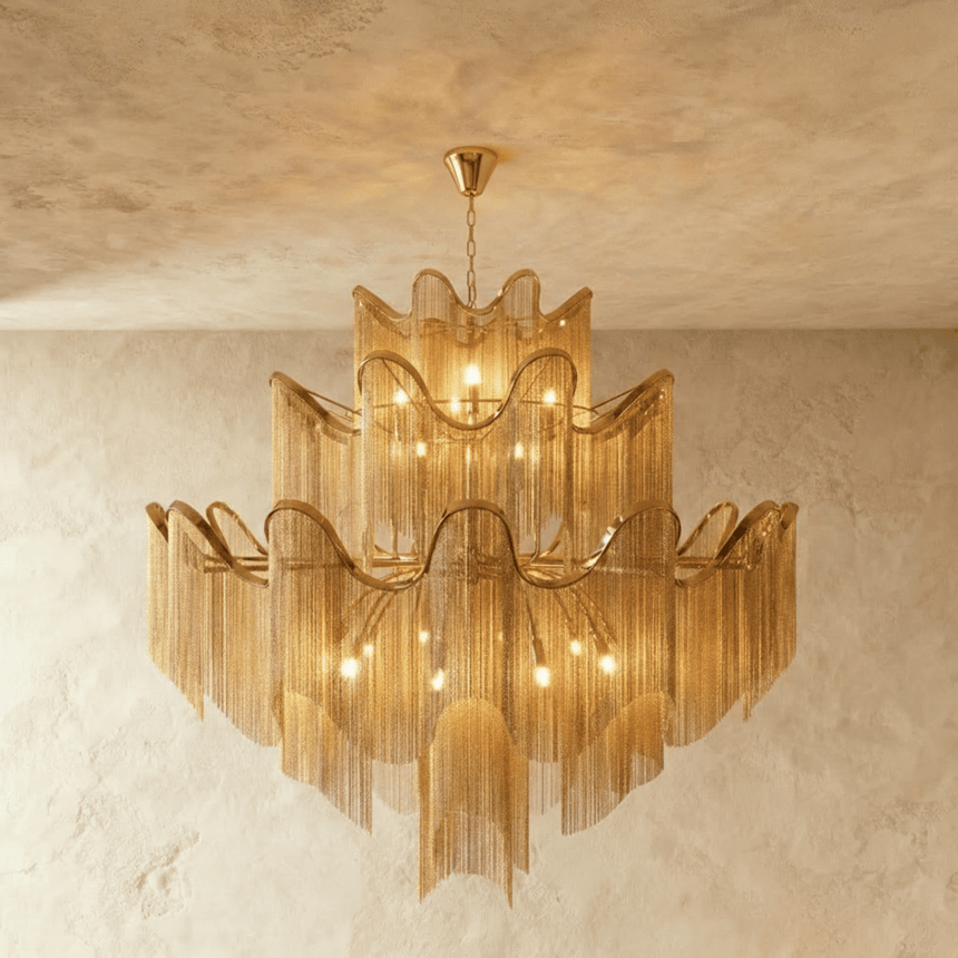 The largest gold version, five tiers of wavy bands over long curtains of chain