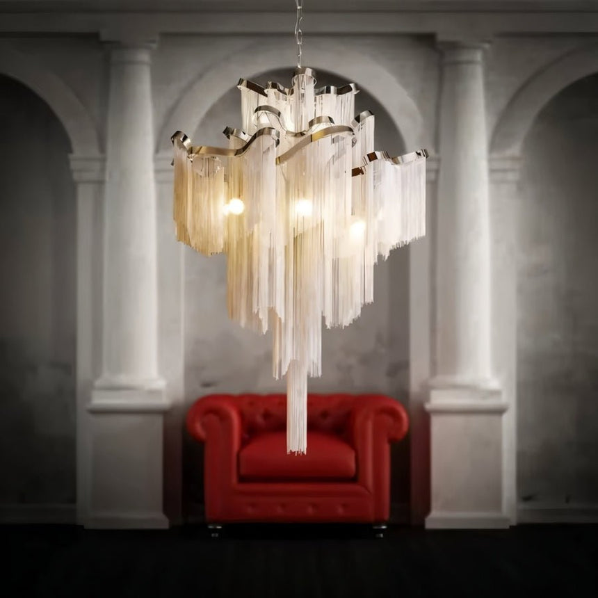 The silver version hanging between stone columns above a deep red button sofa