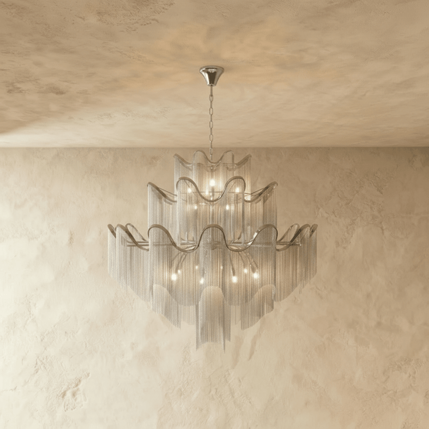 The same tiered form in silver, wavy bands above curtains of fine hanging chain