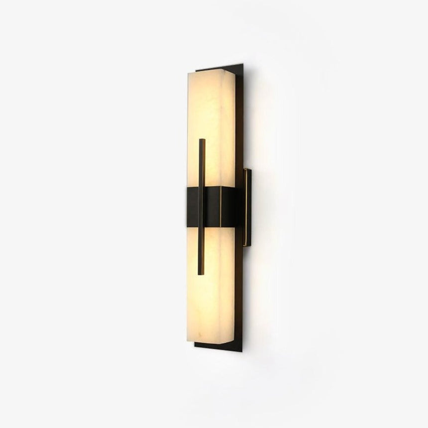 The veining in the panel picked out by the light along the sconce
