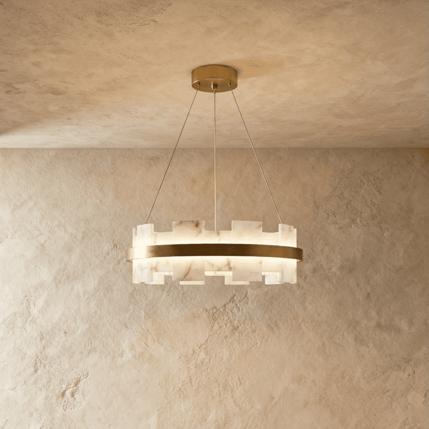 The smaller stepped stone ring lit against a pale plaster wall