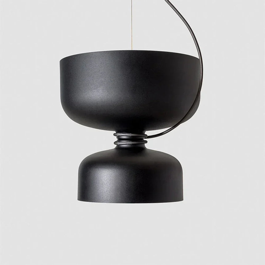 Black pendant with a wide bowl photographed against gray