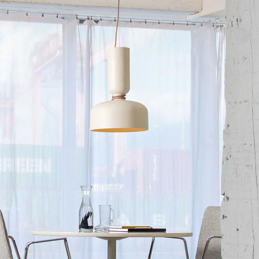 Pendant above a small table by a bright window