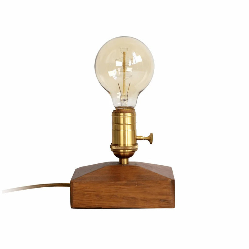 Small table lamp with the squared wood base and the brass holder
