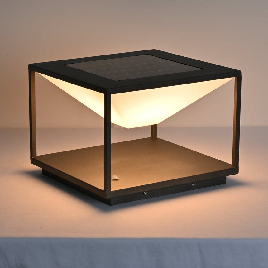 The lit cone spilling light down onto the base plate inside the frame