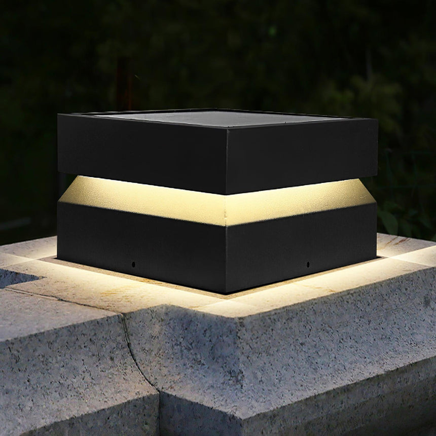 The cap lit on a granite pillar with the lit gap running around it