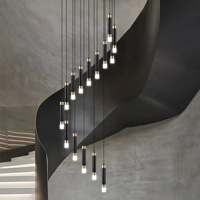 The spiral lit against a bare concrete wall above a flight of stairs