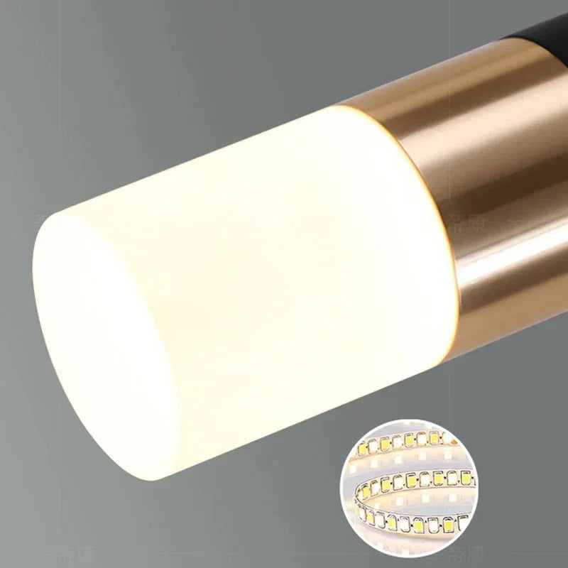 Close view of one brass capped cylinder with the opal diffuser below it