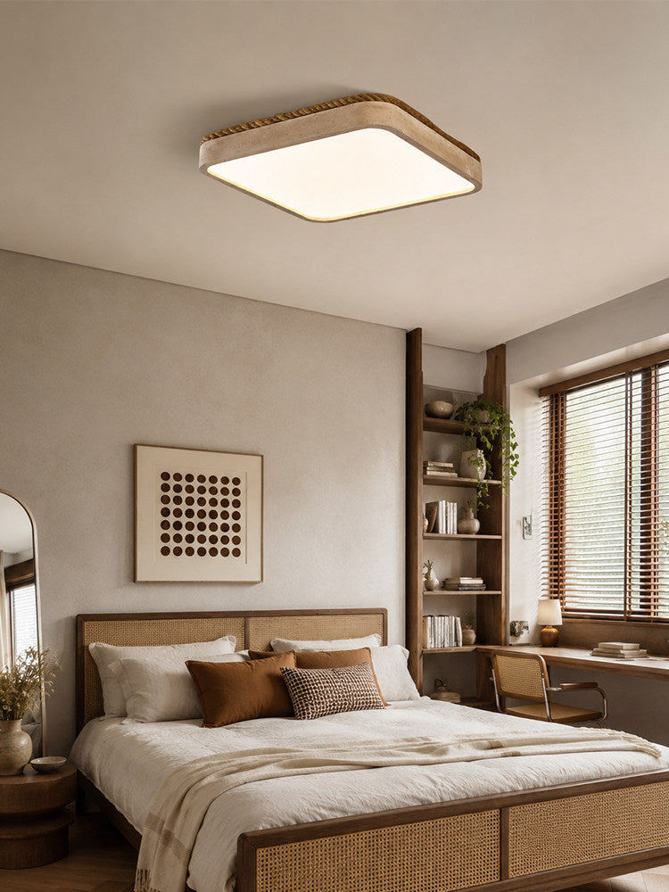 Square travertine ceiling light in a bedroom with a grid print and a tall window