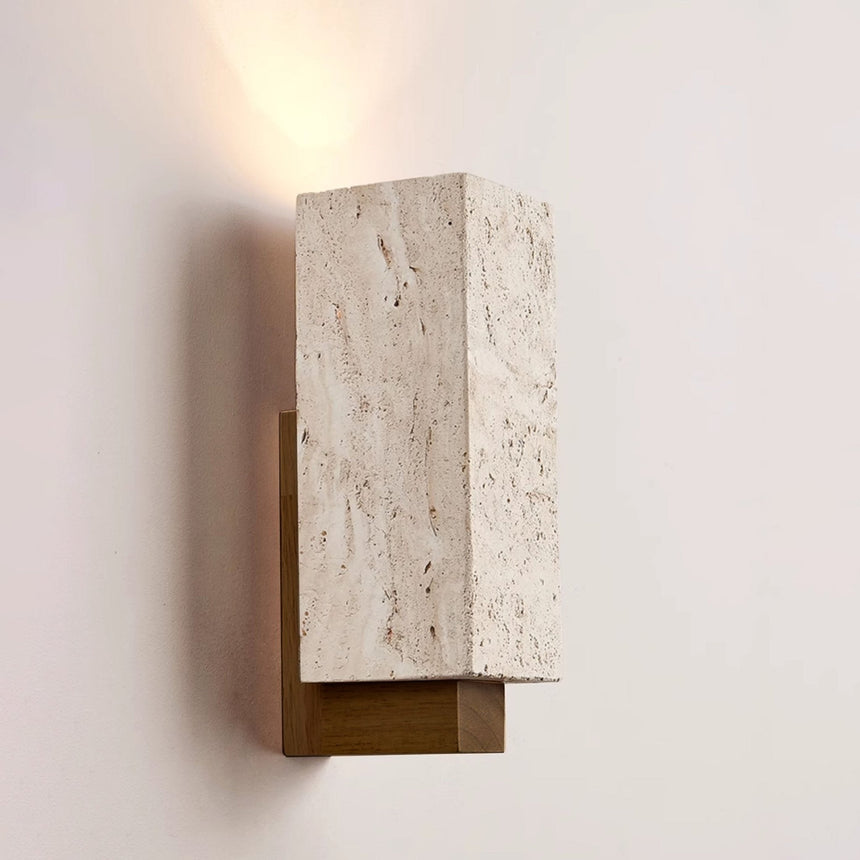 The stone block lit warm, the light fanning up from its open top edge