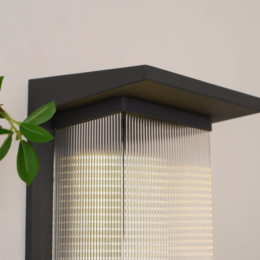 Close view of the flat black cap over the lit ribbed body